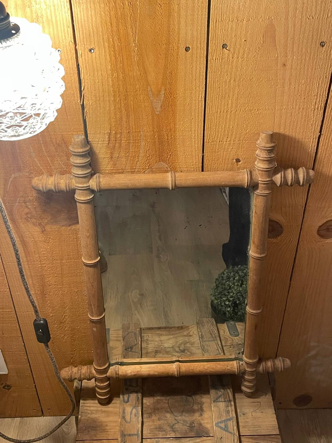 Carved wooden mirror in a bamboo style