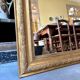 Gold sculpted and moulded stucco trumeau mirror 113 x 78 cm