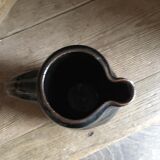 Ceramic pitcher. Belly shape. Motives on both sides