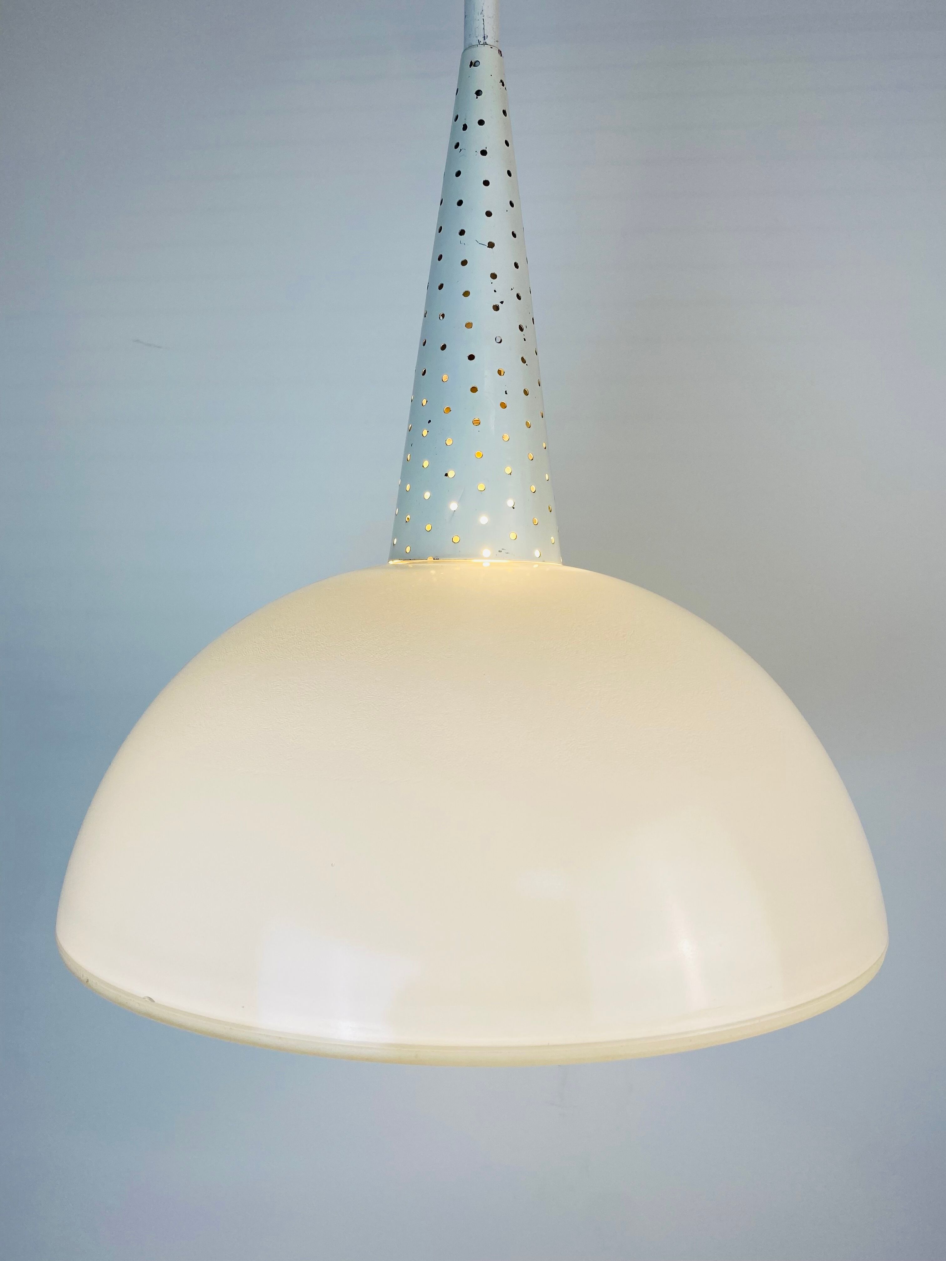 Perforated metal suspension holophanous glass
