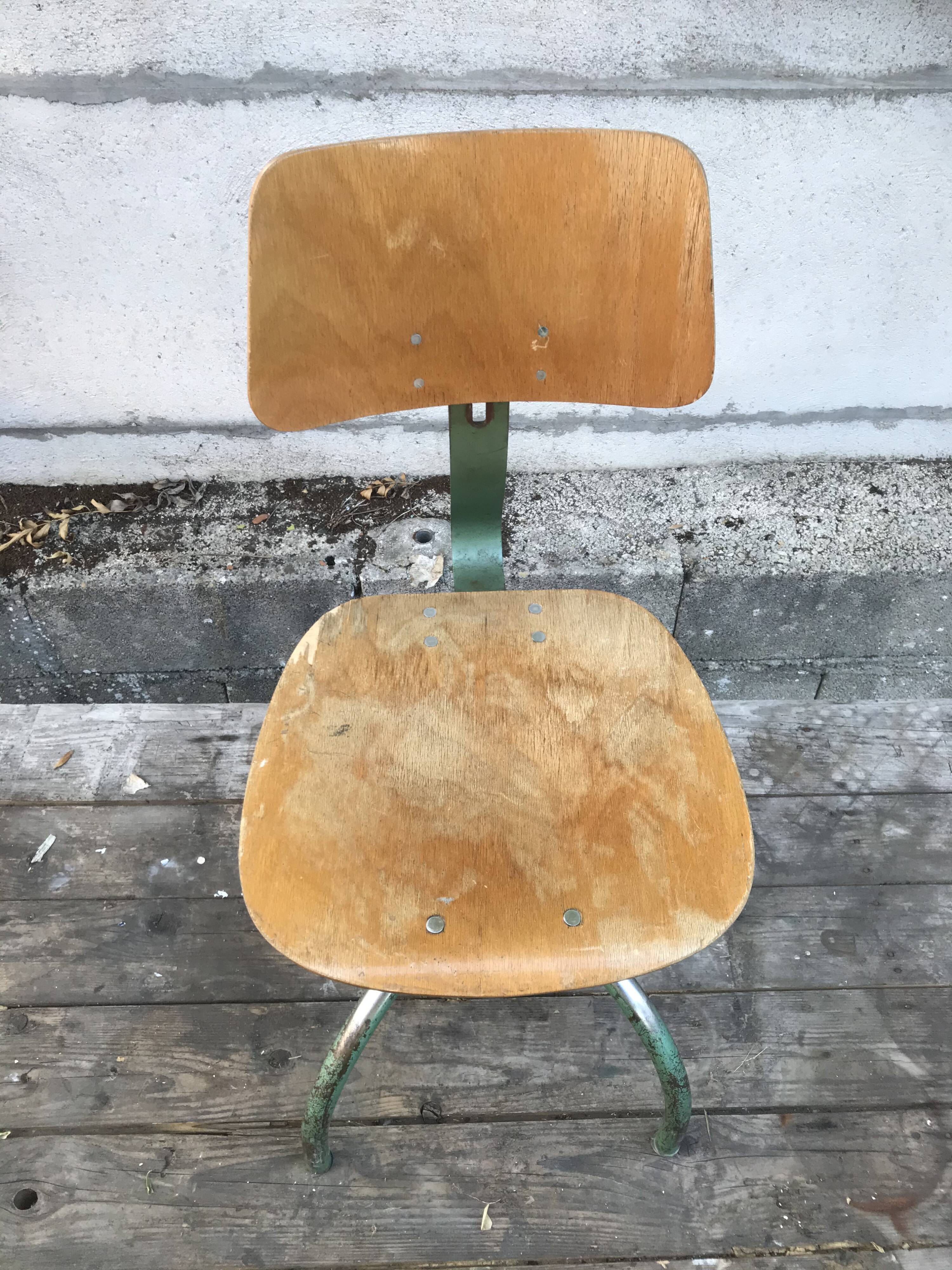 Former green metal workshop chair