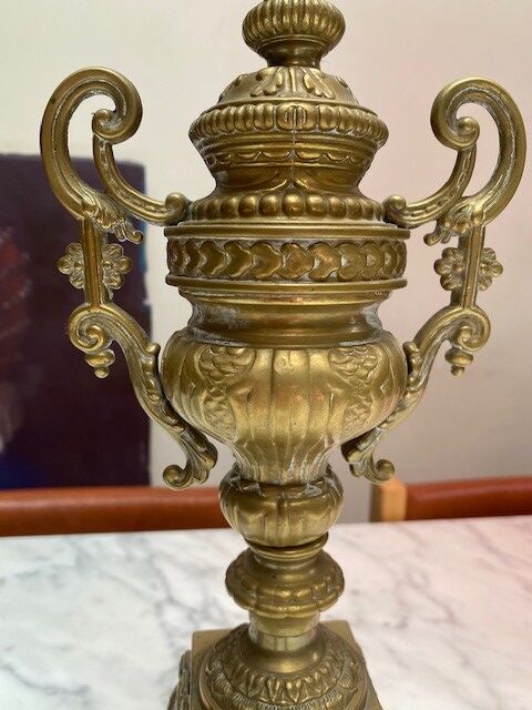 Fireplace trim clock and adornment of antique bronze candelabra