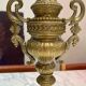 Fireplace trim clock and adornment of antique bronze candelabra