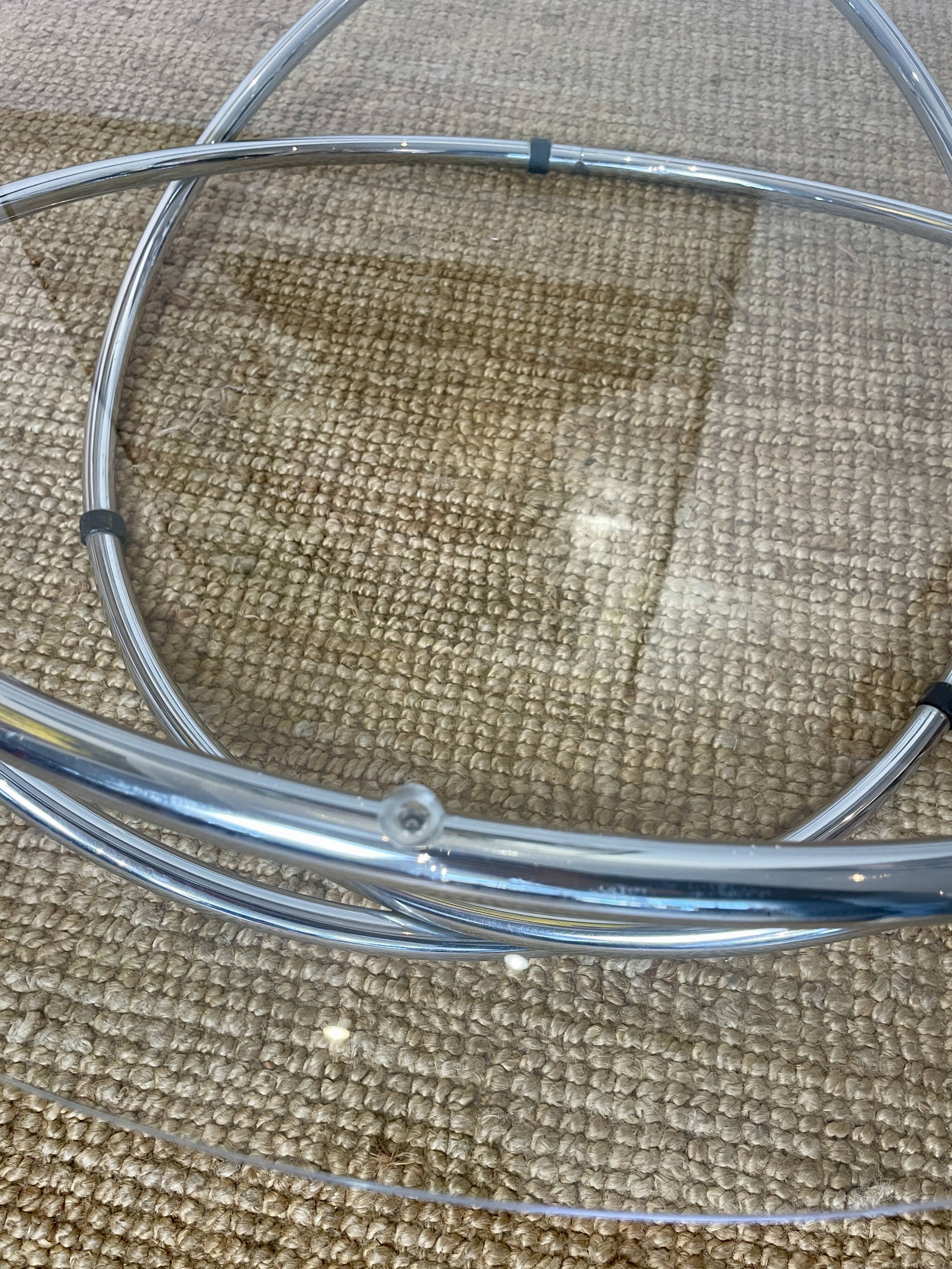 Coffee table with glass top and chrome tubular base