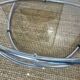 Coffee table with glass top and chrome tubular base