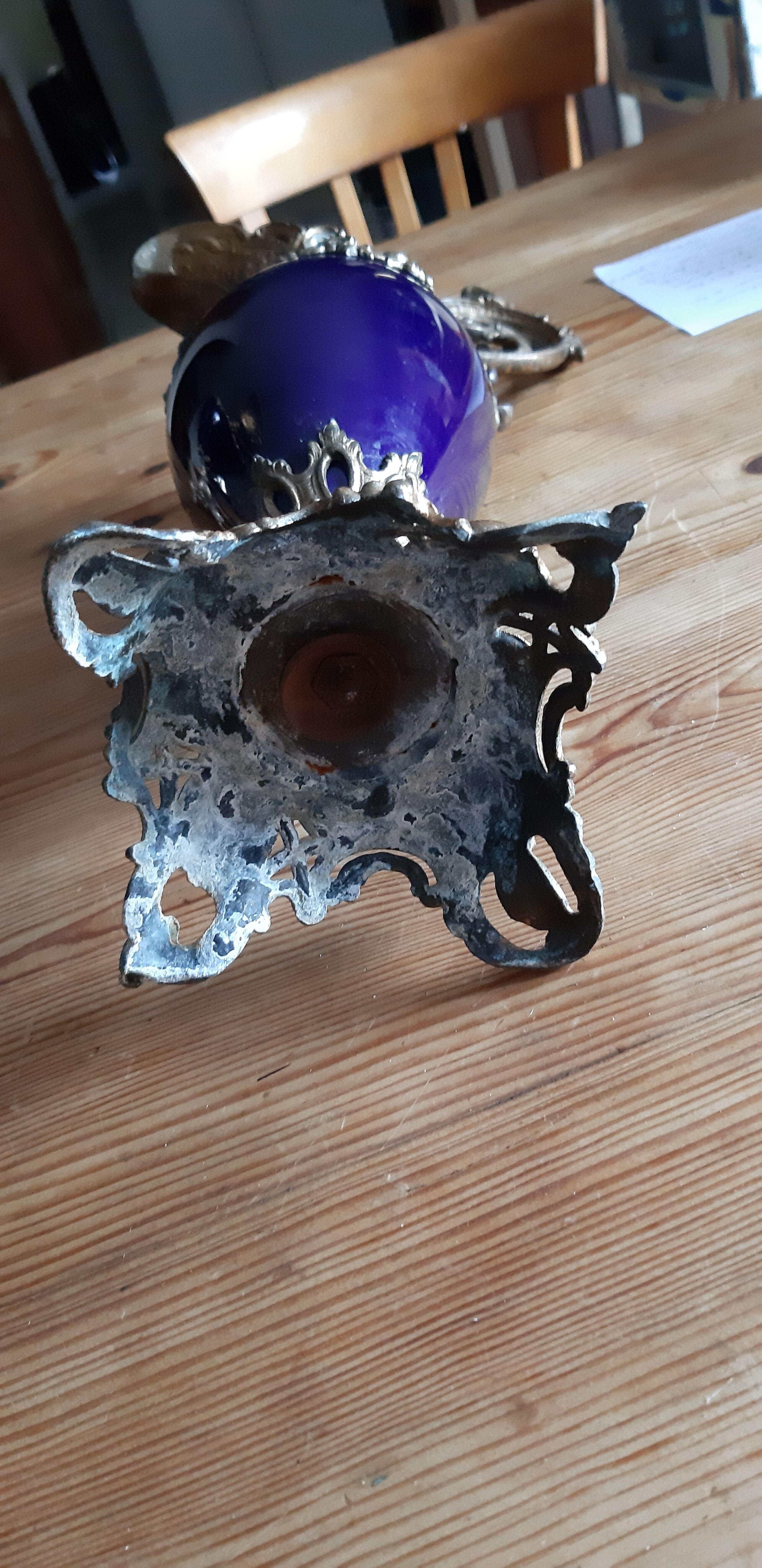 Pair of golden regulated ewers and blue glass