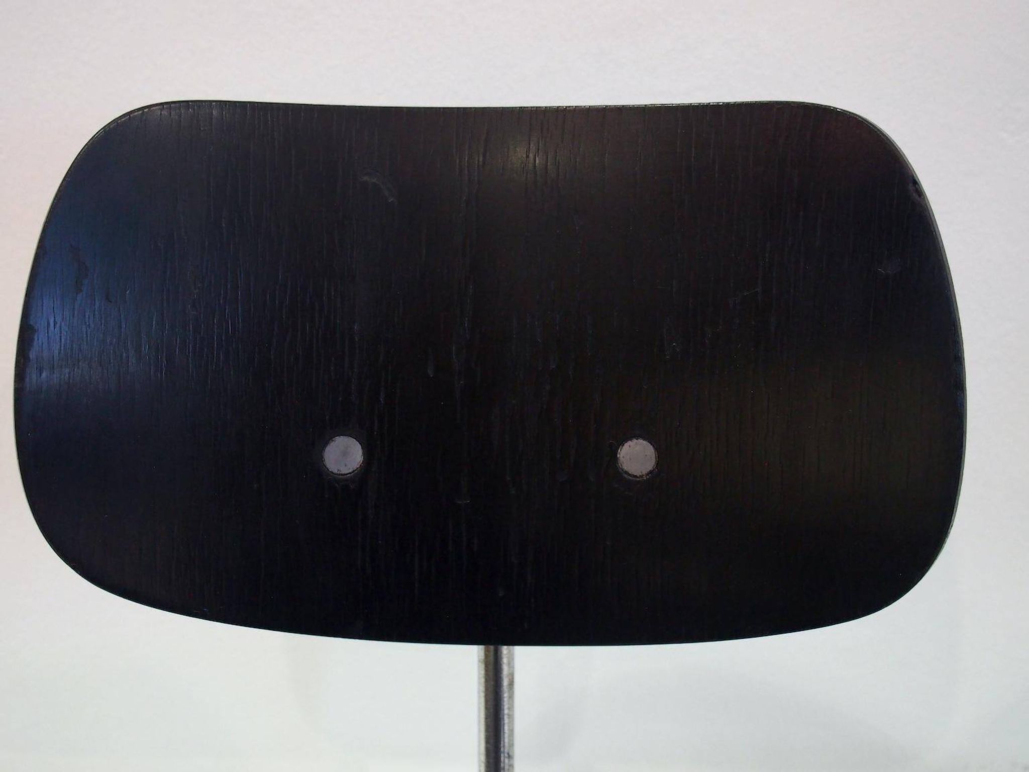 Set of four Egon Eiermann model SE 68 chairs in black lacquered plywood and steel.