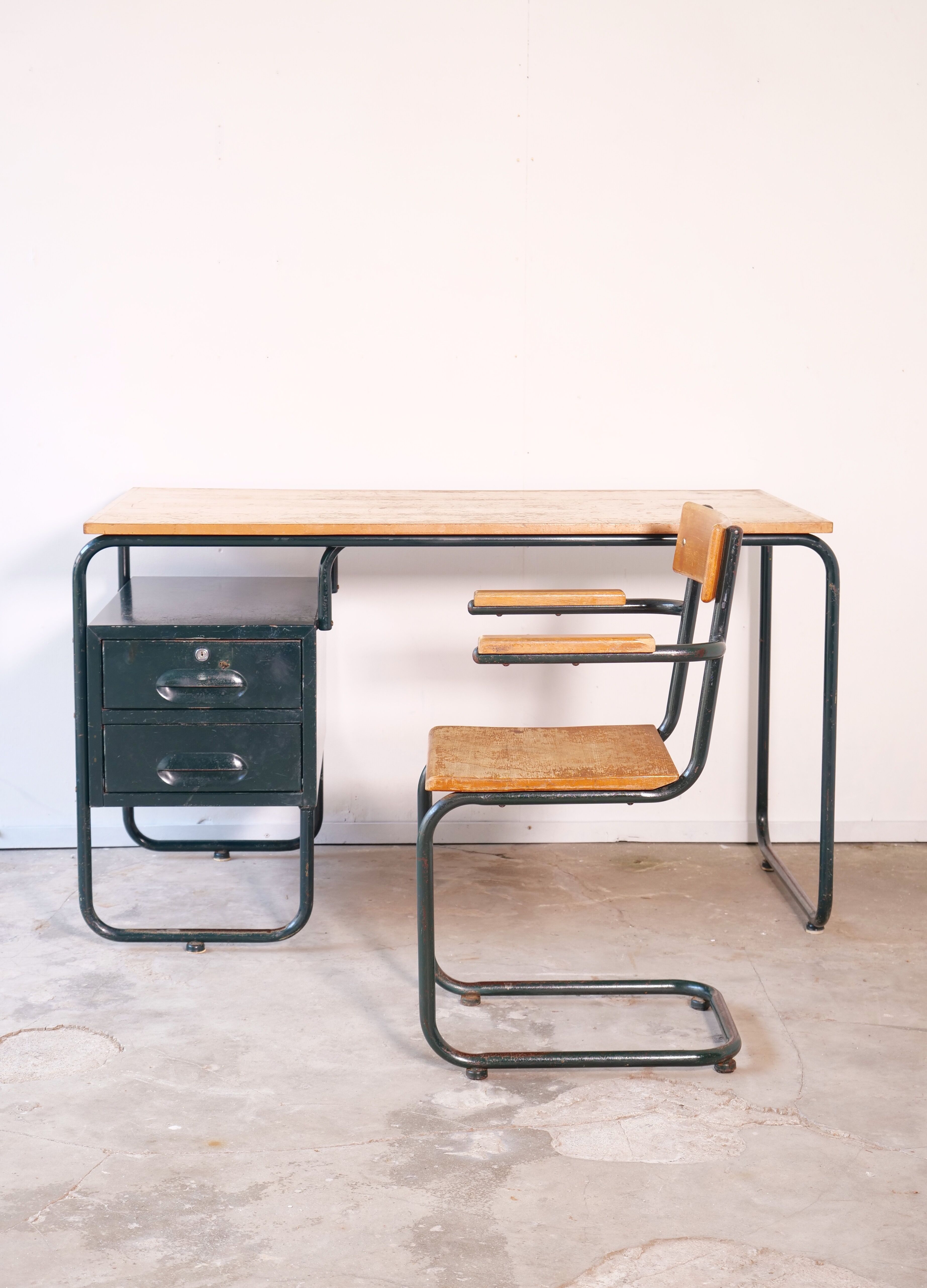Desk with bauhaus style tubular steel chair