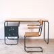 Desk with bauhaus style tubular steel chair