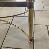 Coffee table in glass and gold metal
