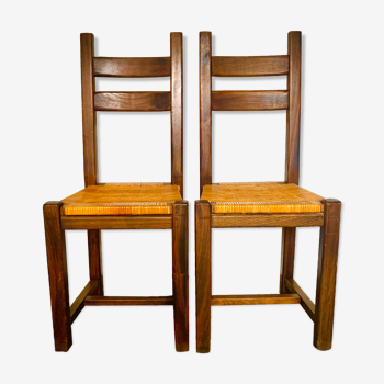 Two brutalist chairs with rattan caning