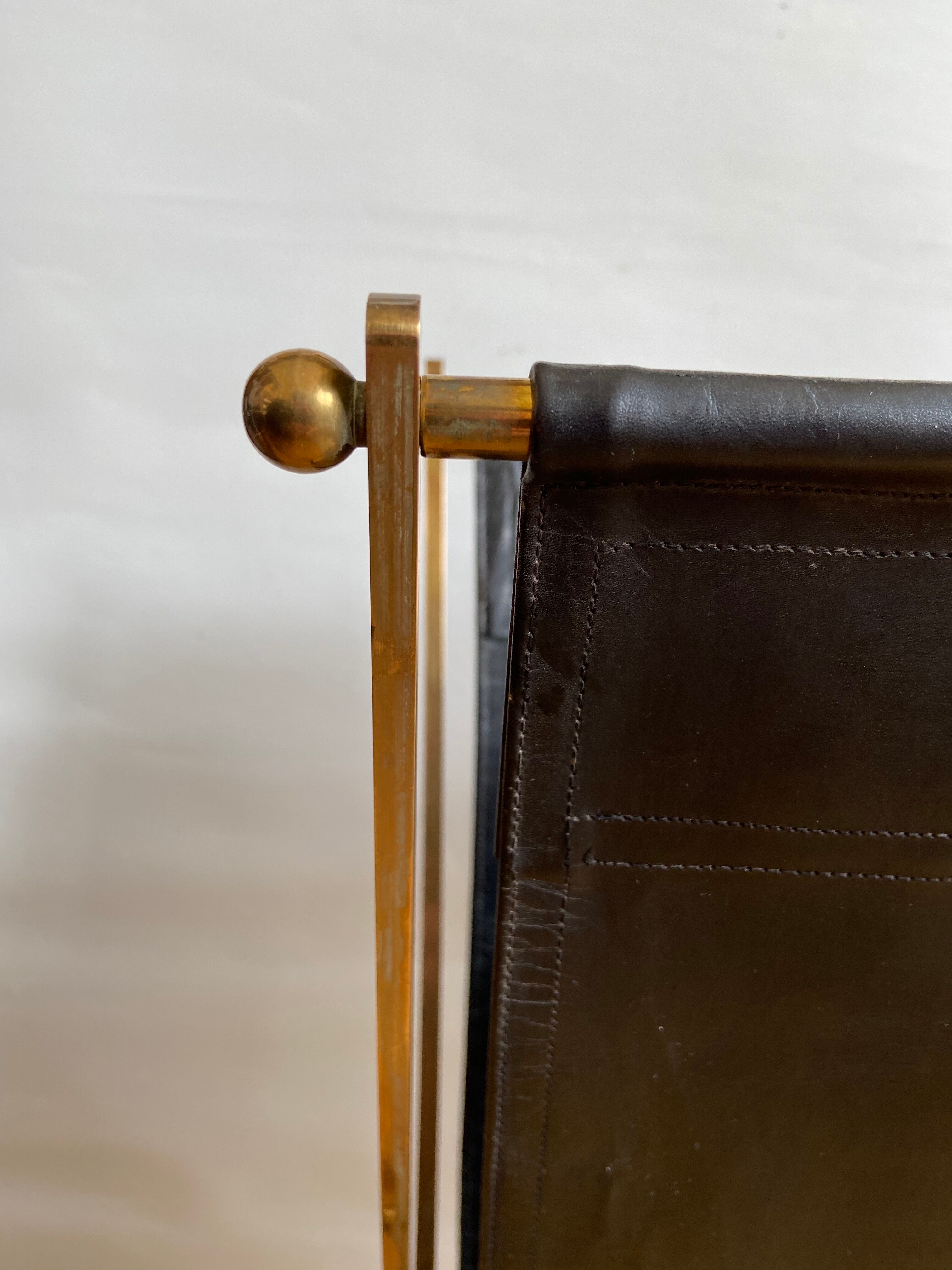 Leather and gilded brass magazine holder