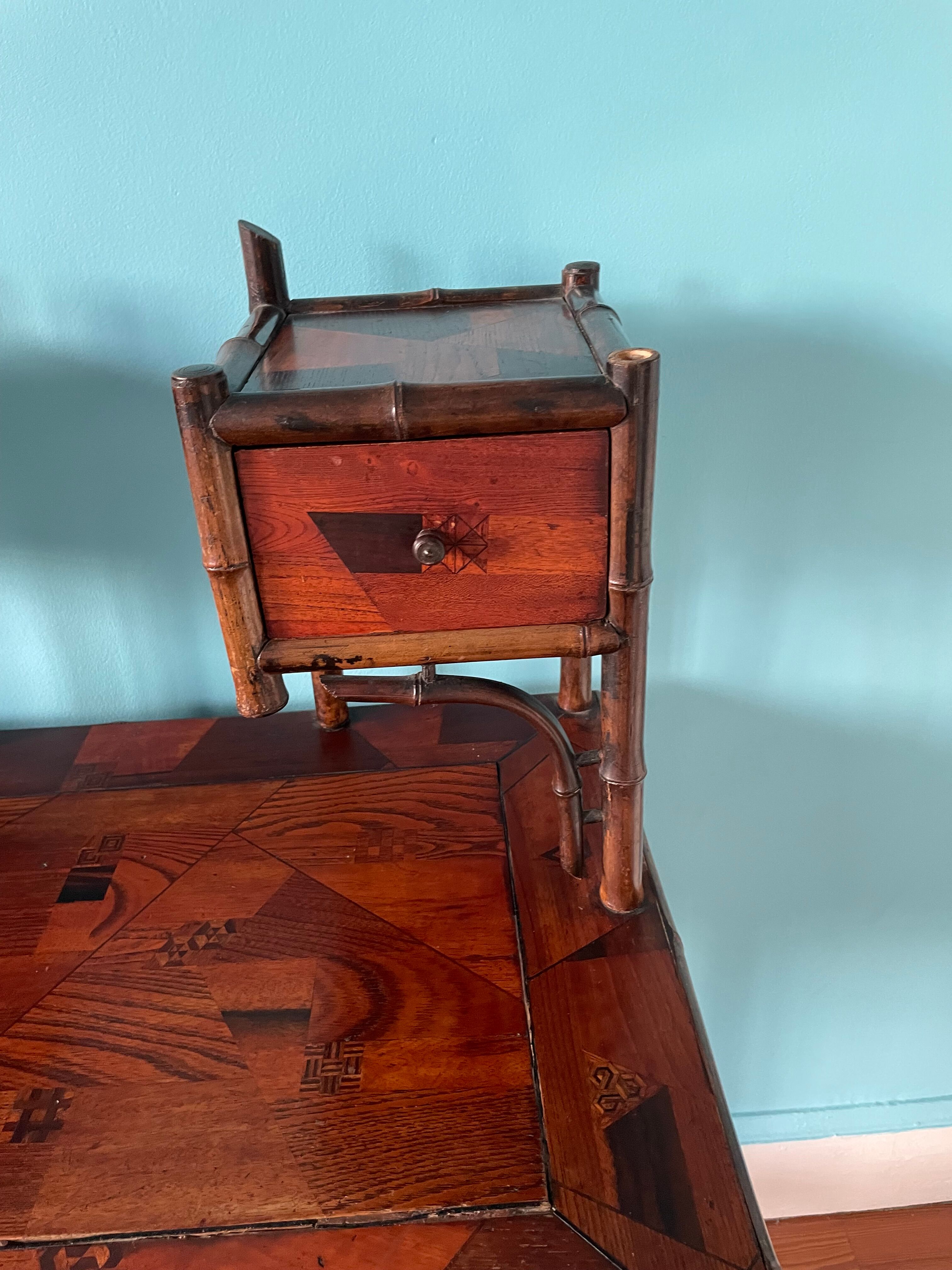 Old secretary in marquetry and bamboo
