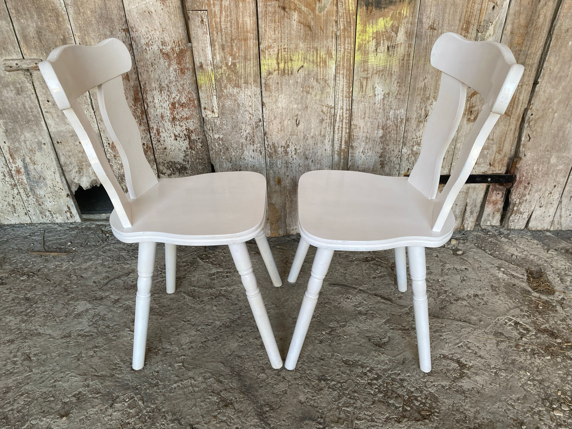 Pair of vintage white wooden bistro chairs