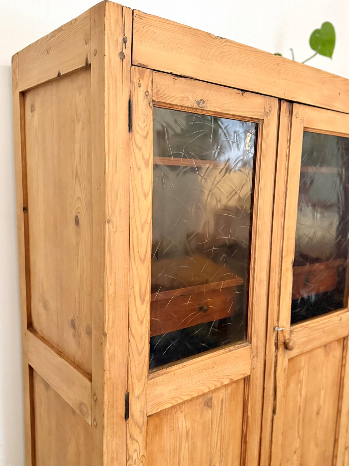 Glass-fronted cabinet in solid wood