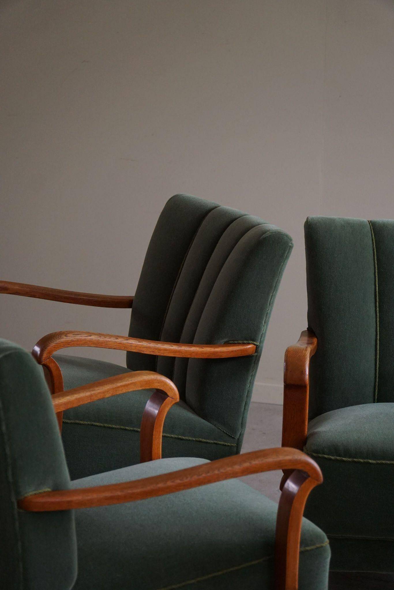 Danish Art Deco, set of 3 oak armchairs, reupholstered in green mohair, 1930s.