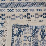 Handmade white and blue ethnic carpet