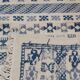 Handmade white and blue ethnic carpet