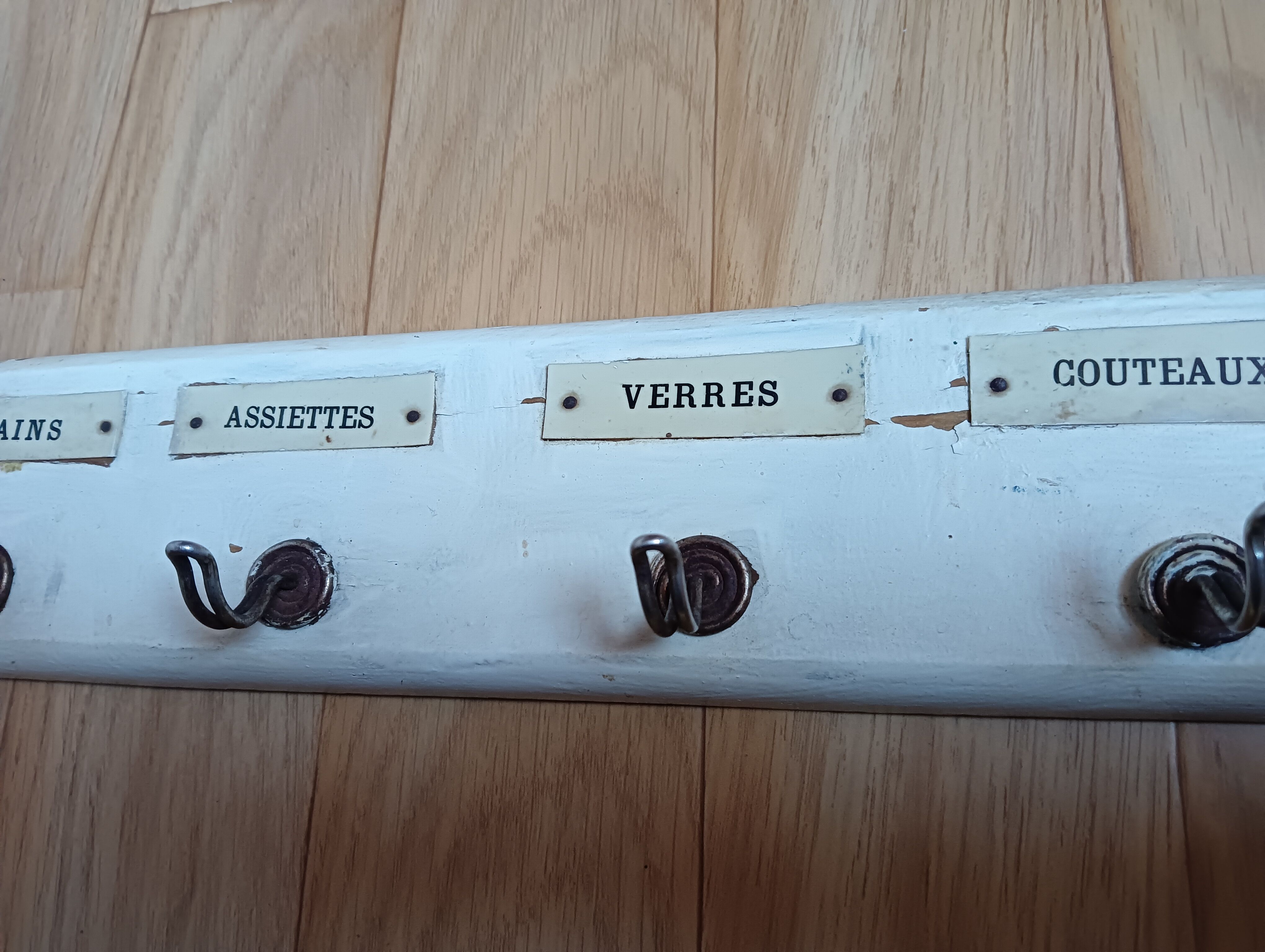 Kitchen towel holder. 5 hooks labeled for hands, plates