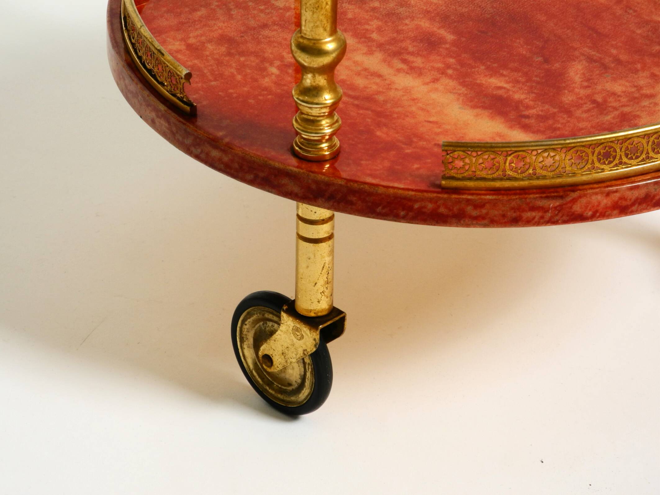 Round, small 1960s Aldo Tura serving or bar trolley in red goatskin leather