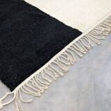 Handmade white and black beret rug