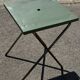 Folding garden or bistro table in khaki sheet metal from the early 1950s.