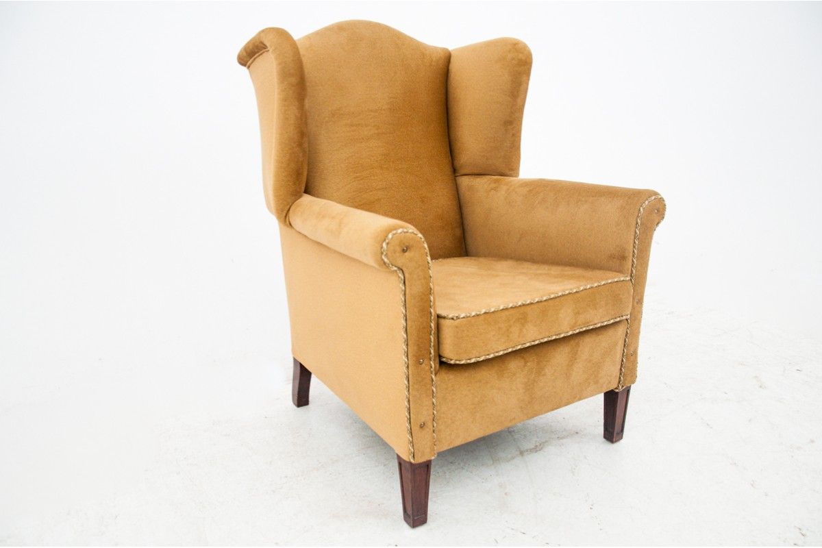 Yellow wingback armchair, Northern Europe, circa 1940s