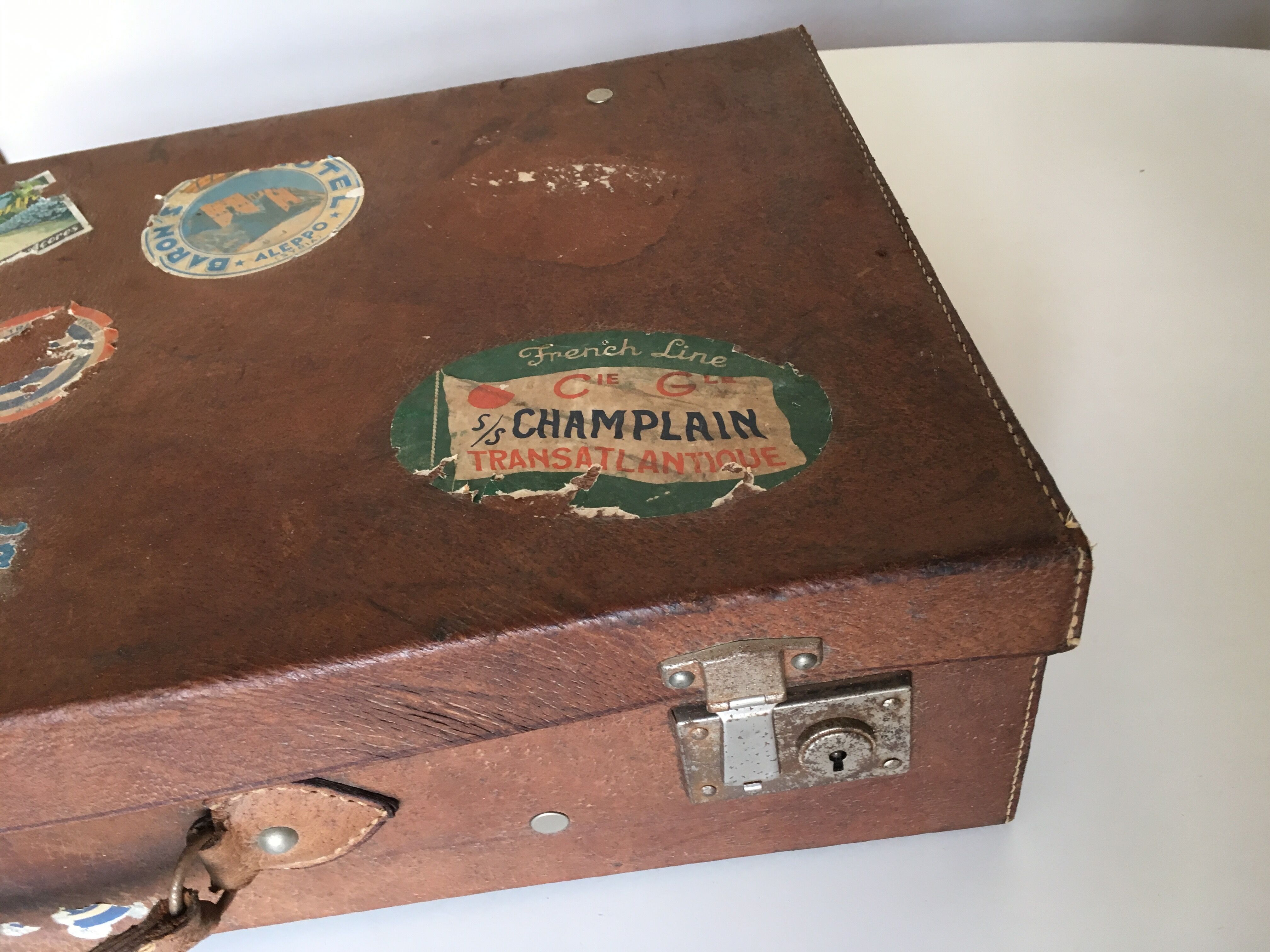 Suitcase of leather with labels of palaces