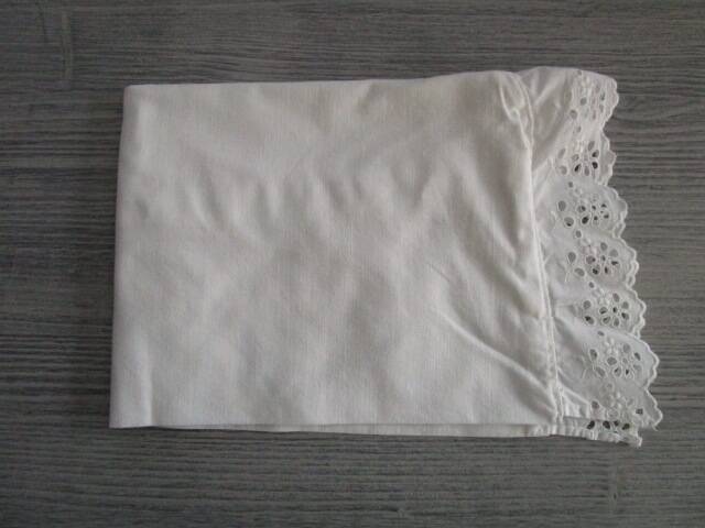 Antique embroidered half-moon crib pillowcase