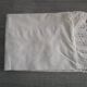 Antique embroidered half-moon crib pillowcase