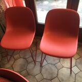 Red muuto "visu" chairs with sled base