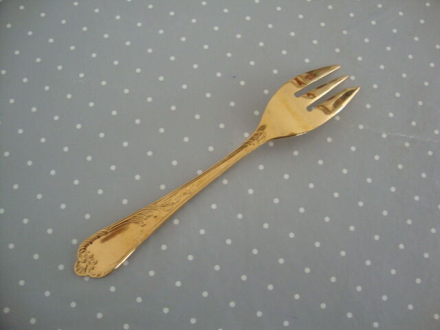 Golden metal cake forks