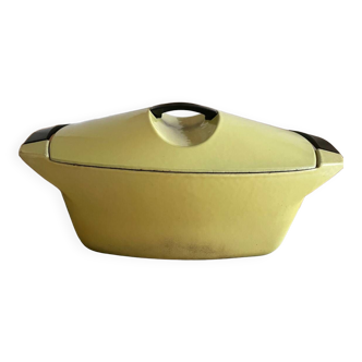 Yellow enameled cast iron casserole dish designed by Raymond Loewy