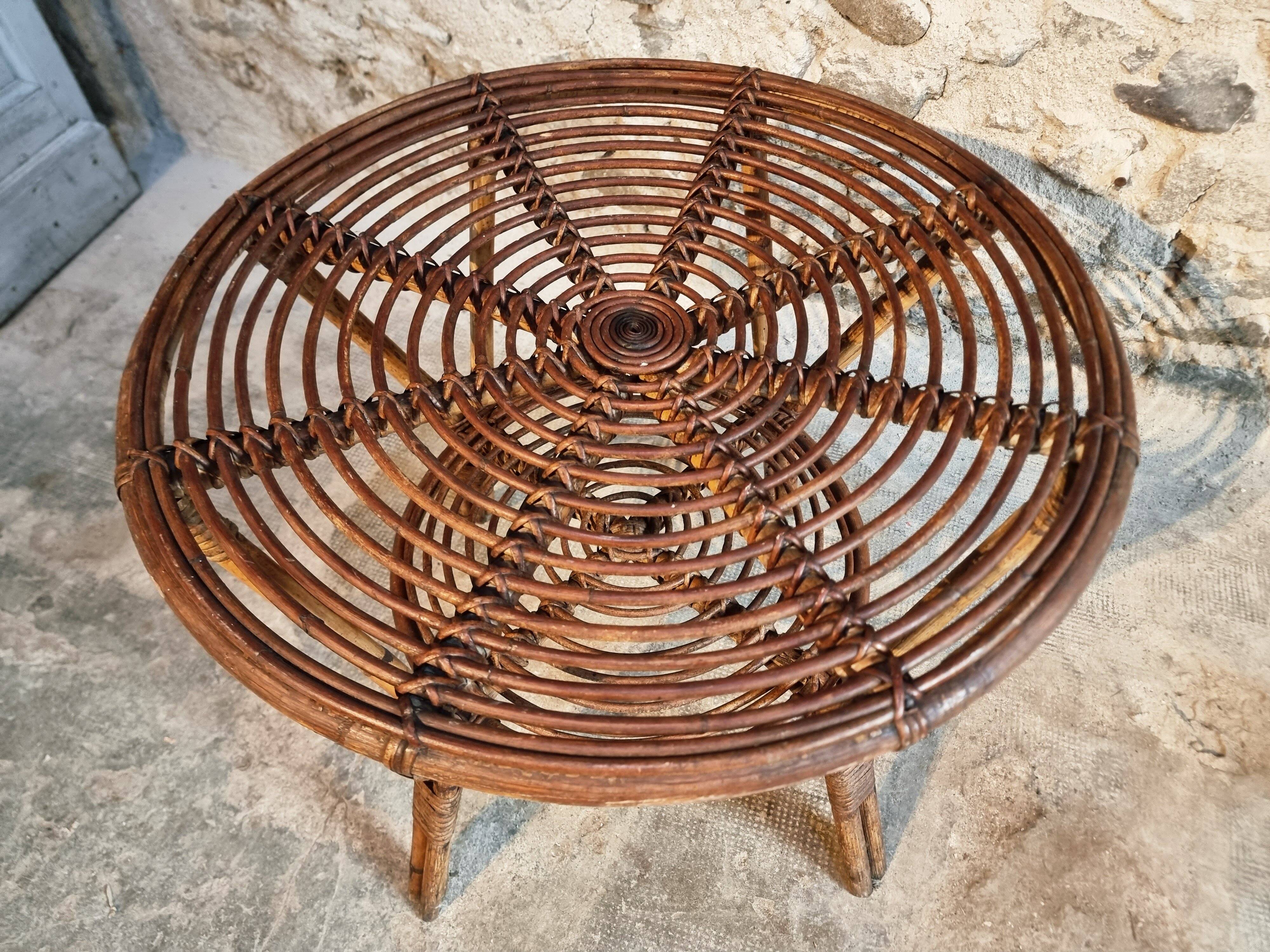 Vintage rattan lounge set, French wicker armchairs and round table, circa 1930–1950.