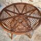 Vintage rattan lounge set, French wicker armchairs and round table, circa 1930–1950.