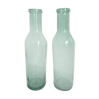 Paire d'anciennes bouteilles de lait, verre teinté