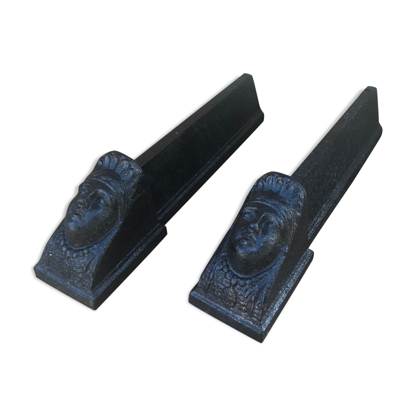 Old pair of chimney caterpillars shape of the head of a woman in iron