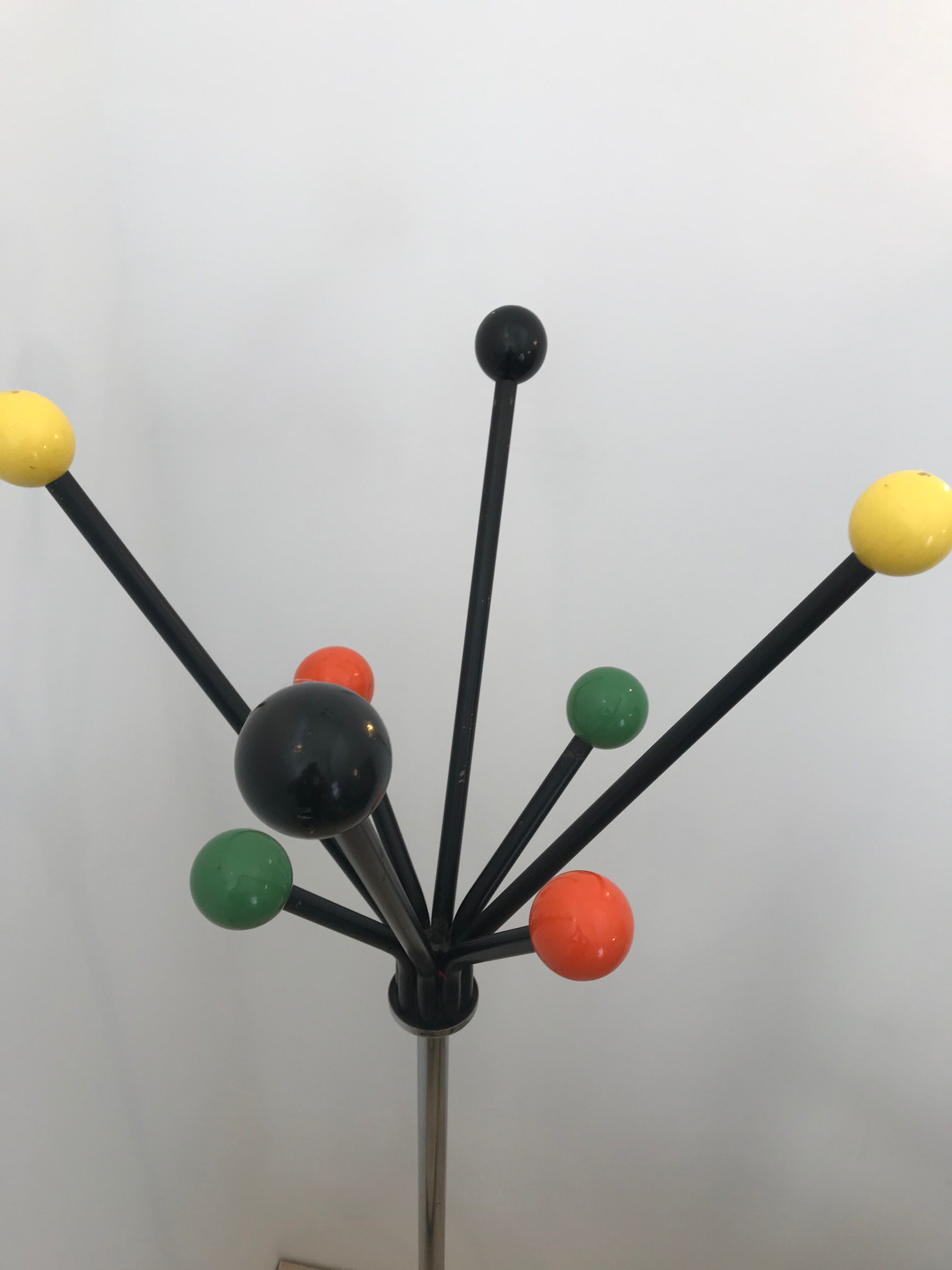 Wearing chrome parrot coat, black and multicolored balls