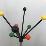 Wearing chrome parrot coat, black and multicolored balls