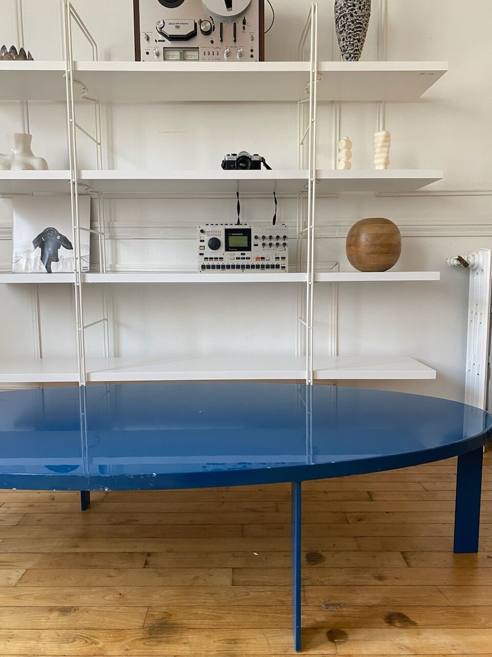 Oval coffee table in blue lacquered wood