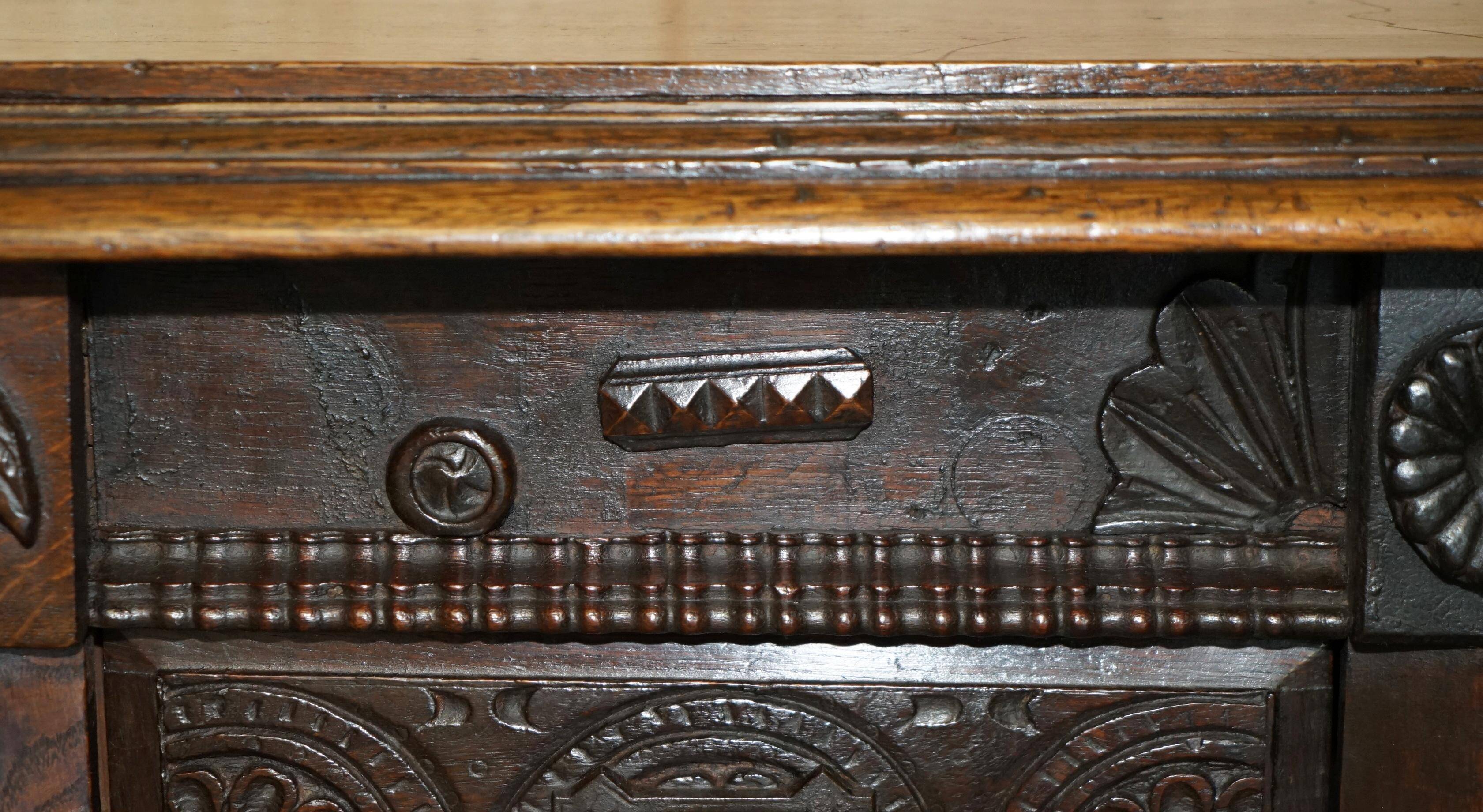 Hand-carved commode from 1685 with sideboards and side cupboards.