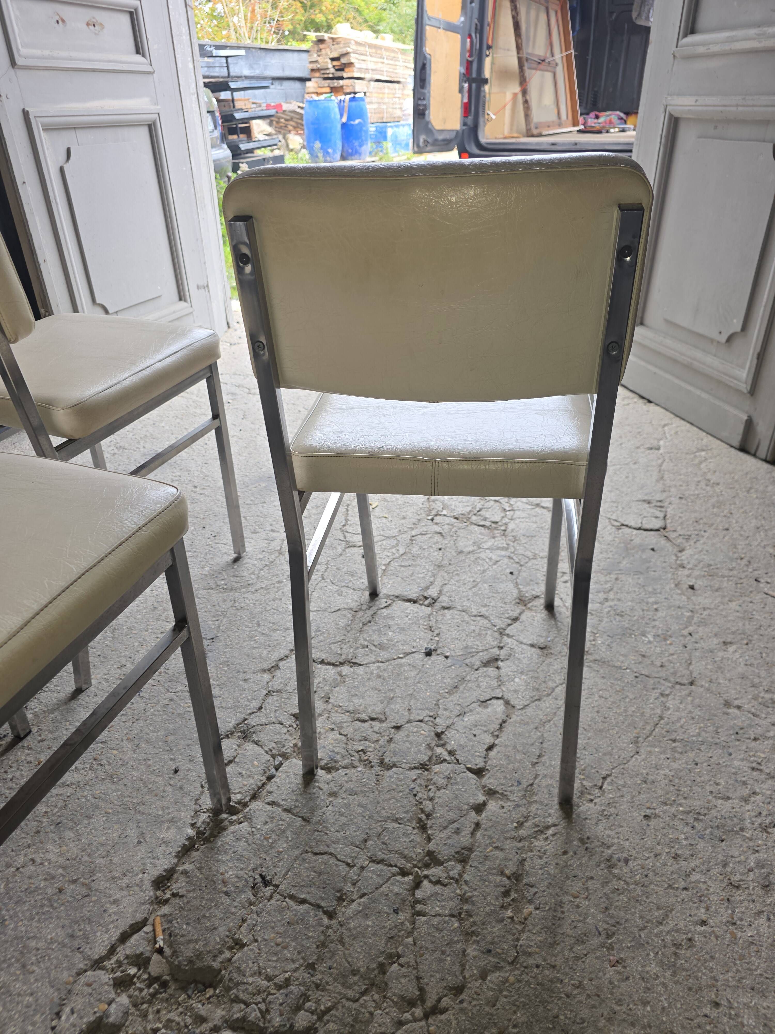 4 chrome metal chairs with faux leather from the 1970s.