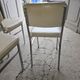 4 chrome metal chairs with faux leather from the 1970s.