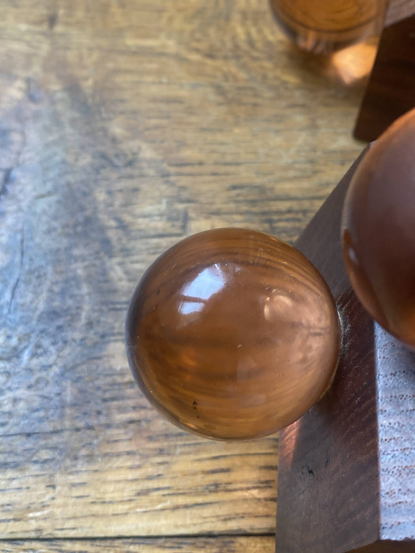 Wooden bookends and spherical glass balls