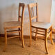 Set of 2 vintage bistro chairs in raw wood.