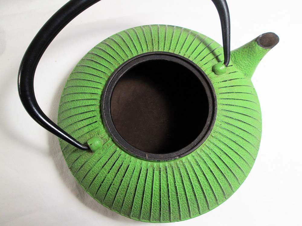 Flat cast iron teapot