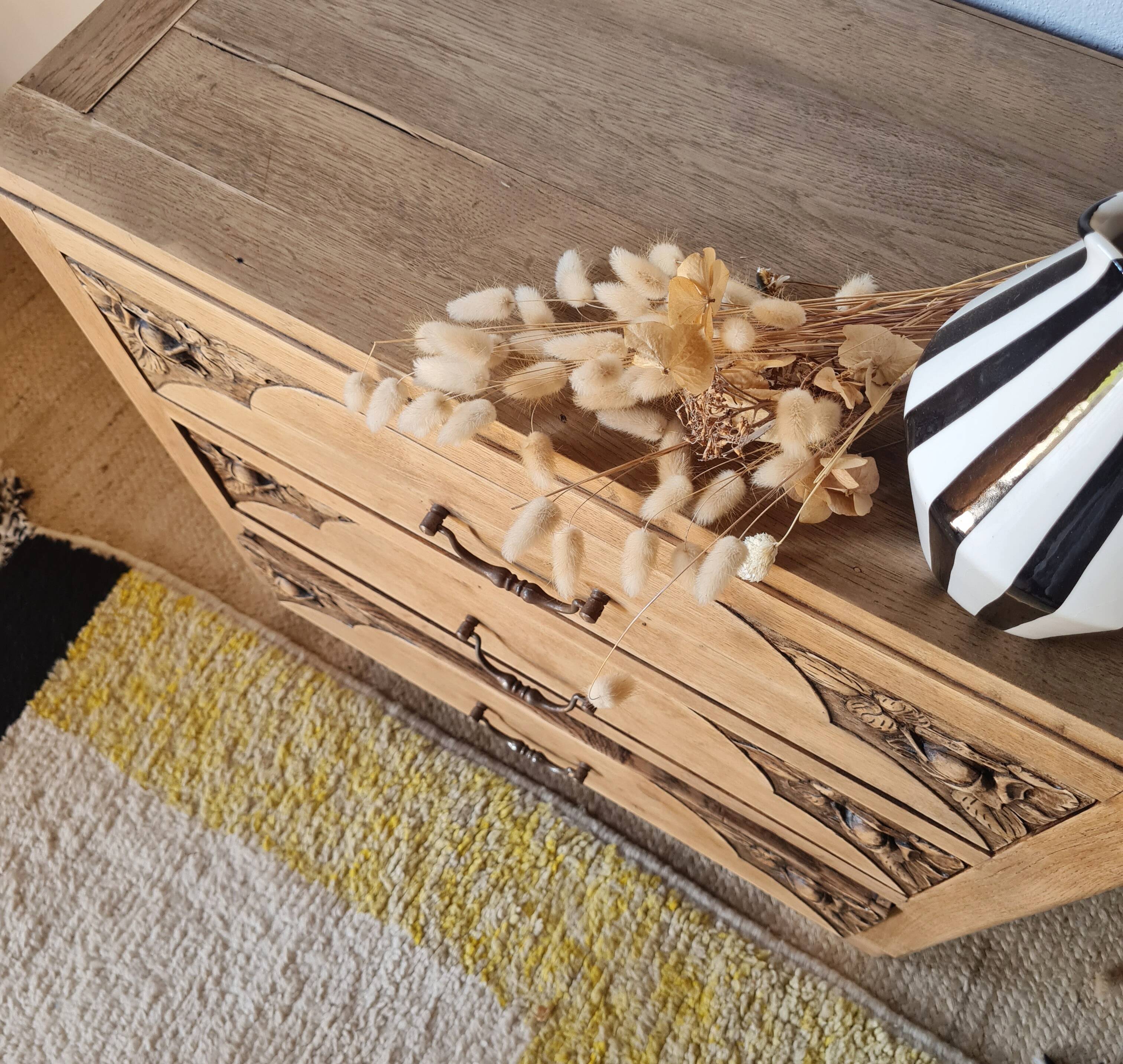 Art Deco chest of drawers in raw oak with carved drawers.