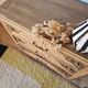 Art Deco chest of drawers in raw oak with carved drawers.