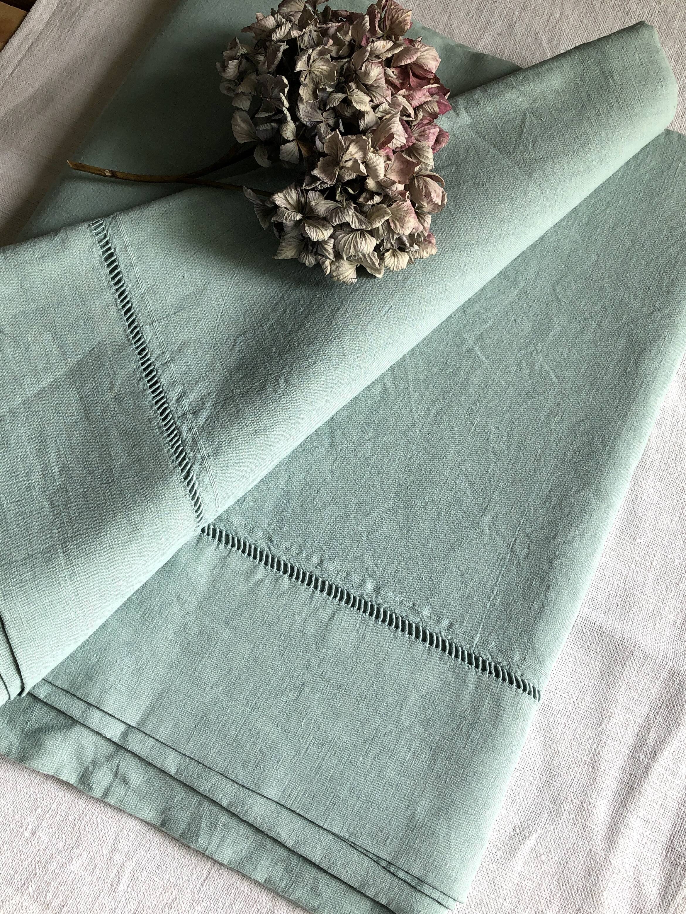 Old sheet in pure washed linen tinted in celadon green