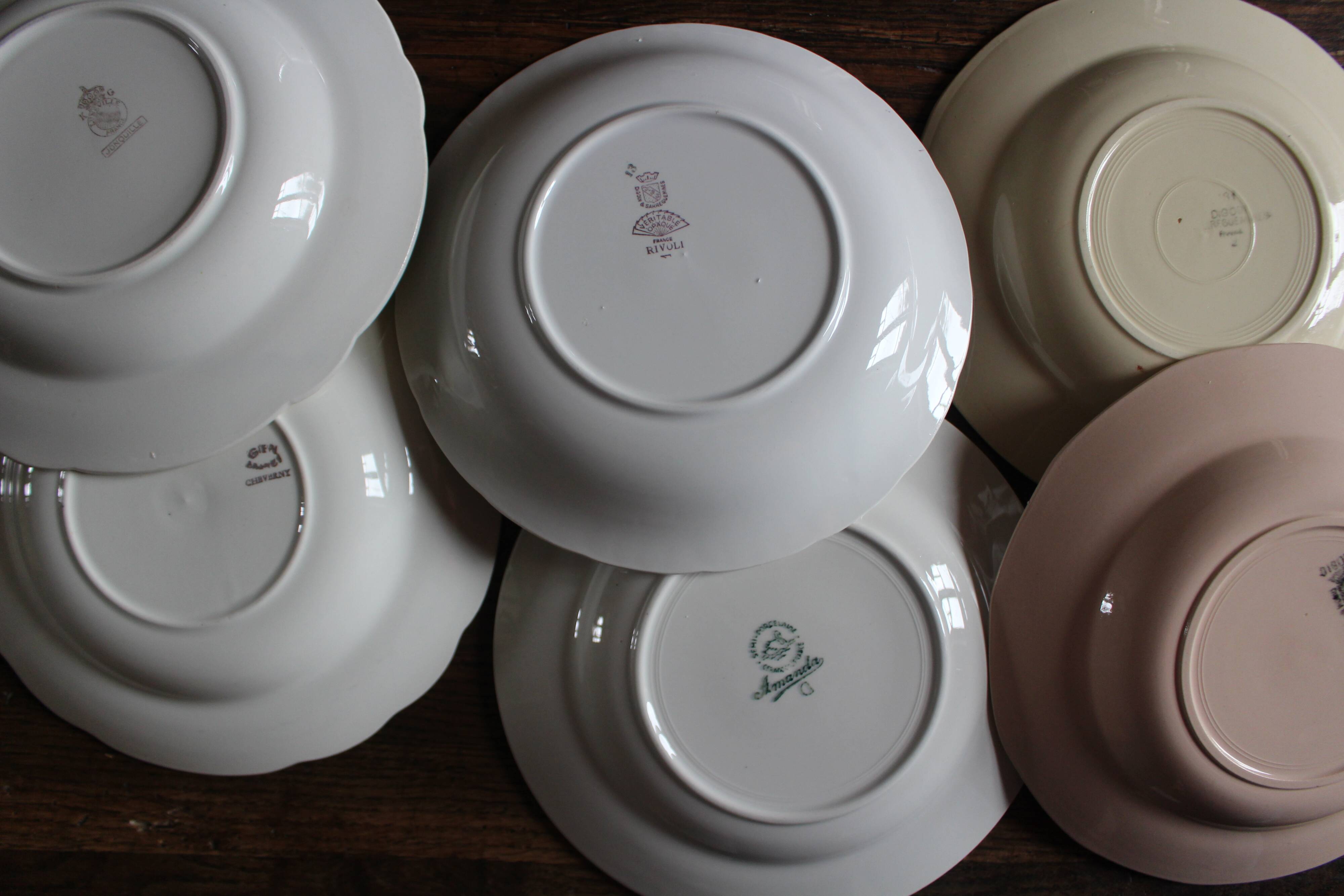 6 mismatched deep plates in floral colours from Digoin, Sarreguemines, Gien.
